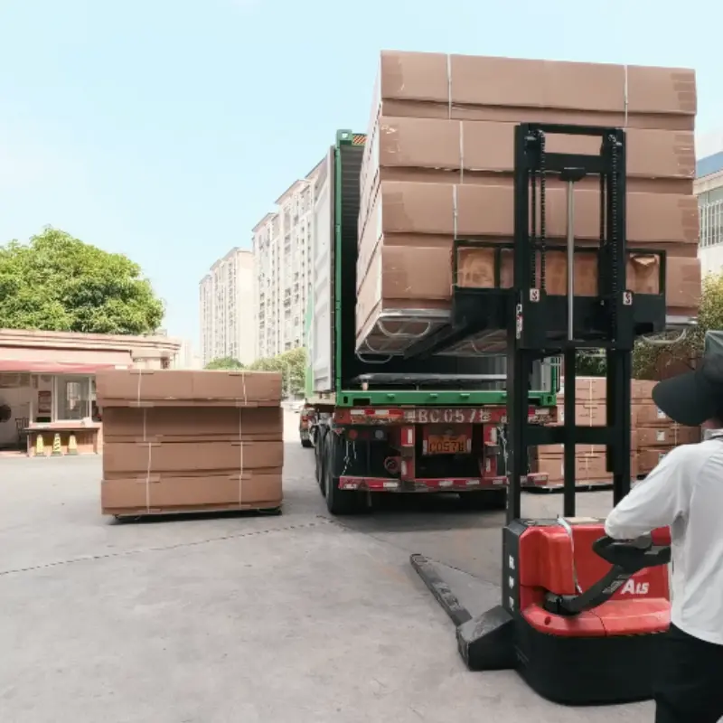 Our packaged mattresses are being loaded into the container by forklift